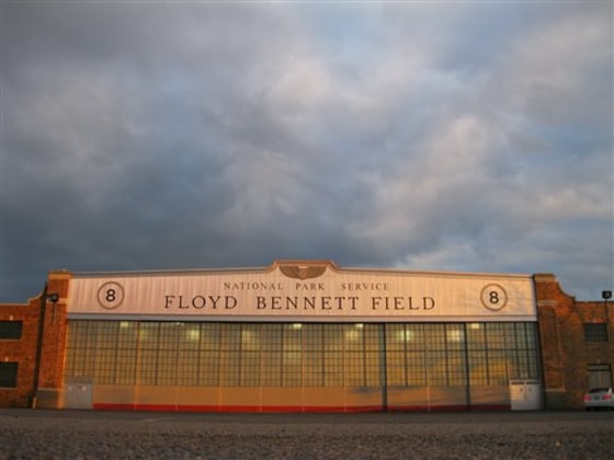 A National Park Service hangar emblazoned with the name Floyd Bennett Field glows orange at sunset March 11 at New York City's "ghost airport" in Brooklyn, N.Y.